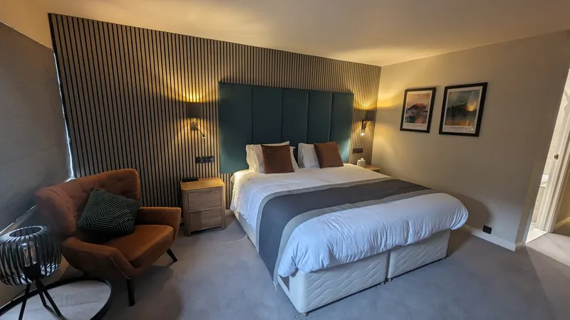Bedroom with a full-height slatted timber feature wall